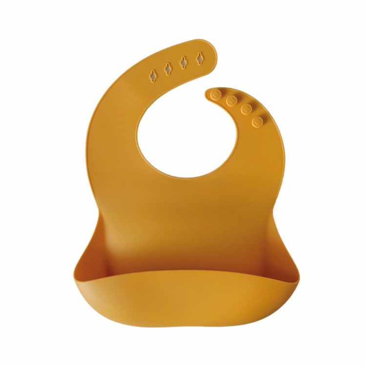 Babero Silicona con bolsillo Storki Mostaza